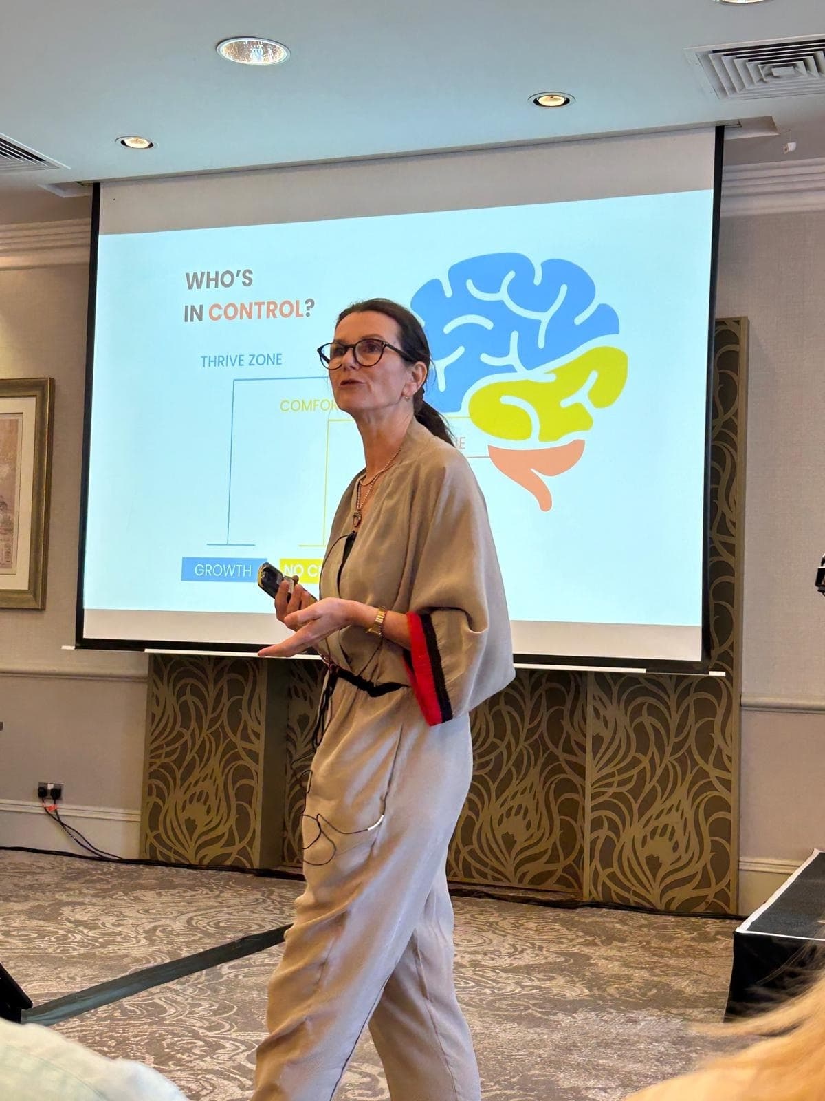 Dr. Jyoti Schonfelder presenting the brain states on stage